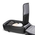 Mark Ryden Global's splash-proof commuter backpack with USB port, black design, holding clothes