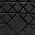 Black quilted fabric detail of Mark Ryden AeroPack ultralight backpack